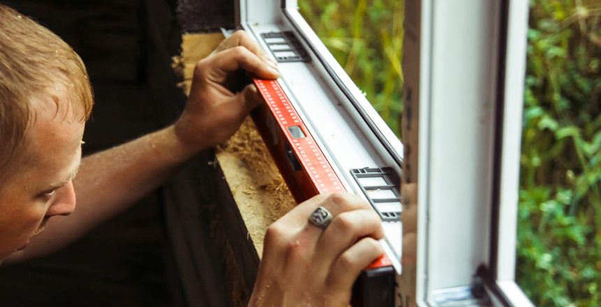 worker checks the level of a window